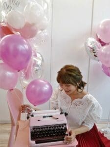 Woman Looking At Her Typewriter