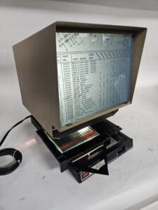Vintage microfiche reader displaying technical data.