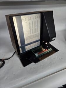 Microfiche reader displaying document on screen.