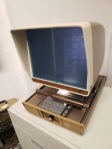 Retro computer with large monitor and keyboard.